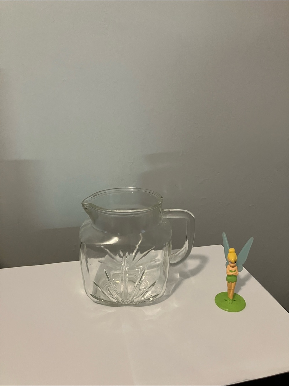 Clear Glass Vintage Pitcher with noticeable pattern.